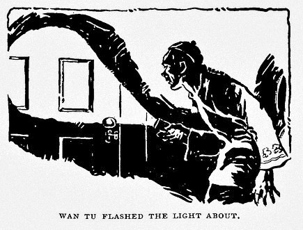 A man flashes a light on a doorway