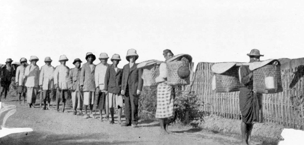 Photo of students in a line walking toward camera