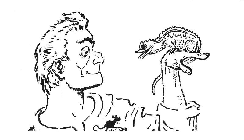 a man holding up a lizard in his hand with a mouse in his shirt pocket