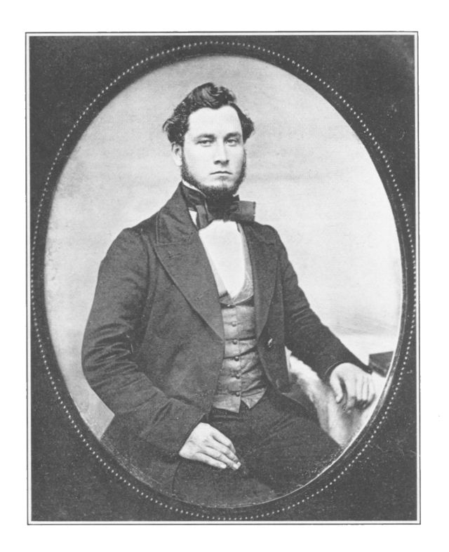 man with dark hair wearing a large tie