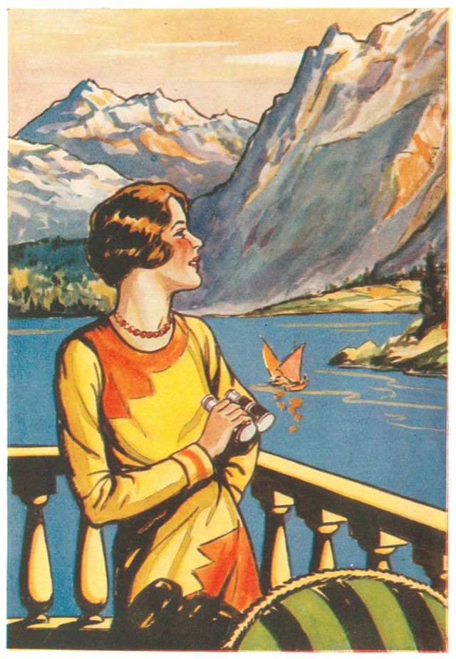 Lady standing on veranda looking out over lake to mountains on far side of lake.