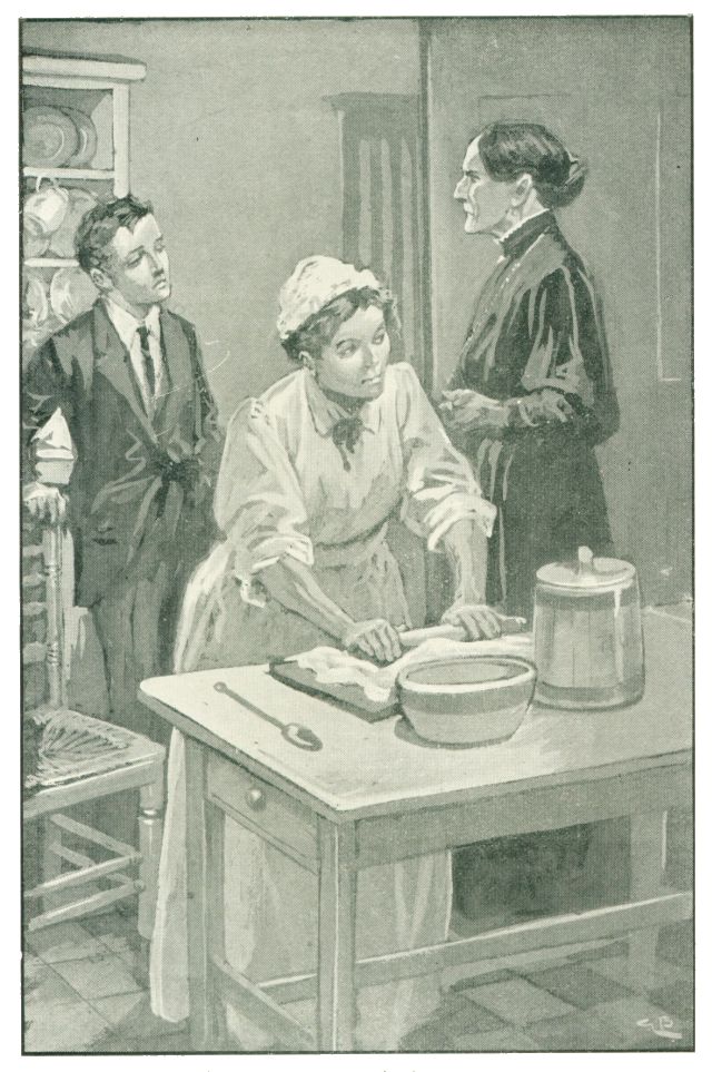 two women and a boy in a kitchen