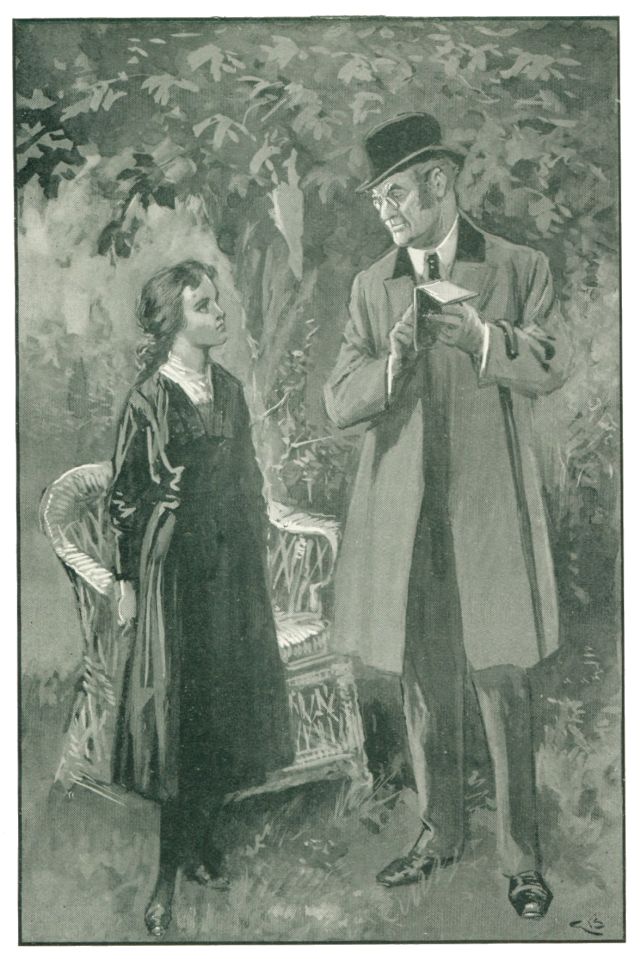 girl and man standing next to a wicker chair in the garden