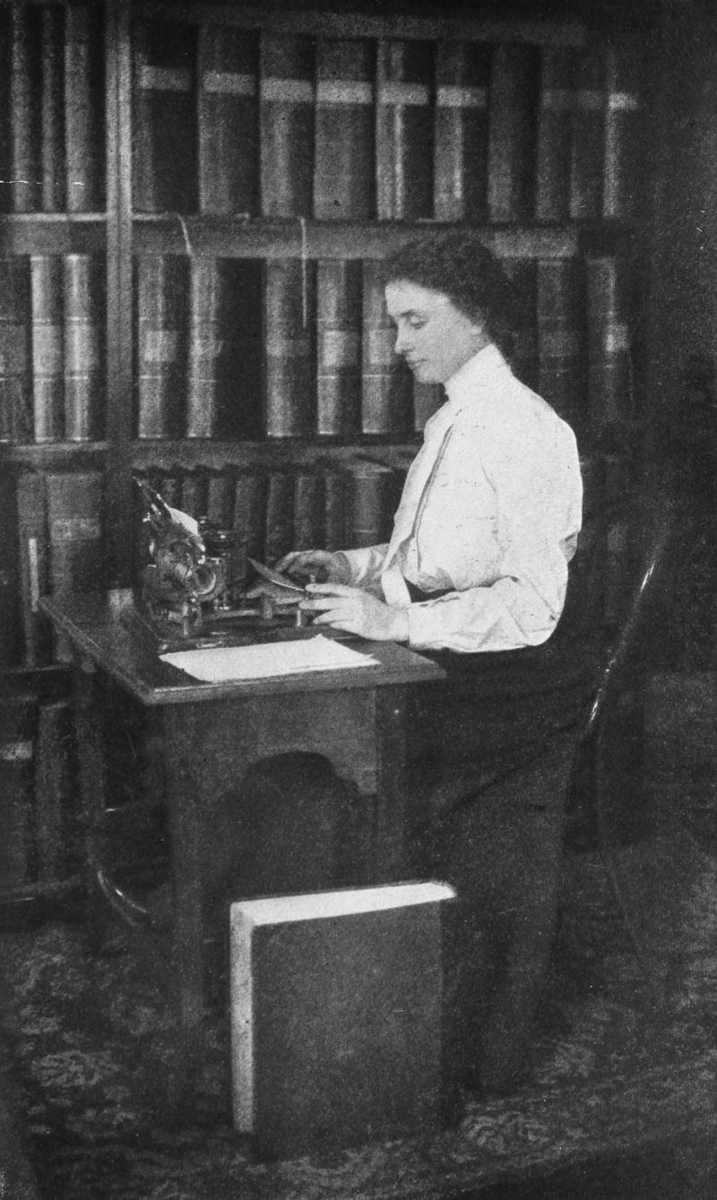 Helen sitting at her desk in her study